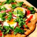 Pizza with Eggs, Roasted Red Peppers, Olives and Arugula