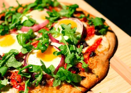 Pizza with Eggs, Roasted Red Peppers, Olives and Arugula