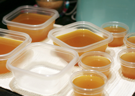 Divide the chicken stock into freezer-safe containers