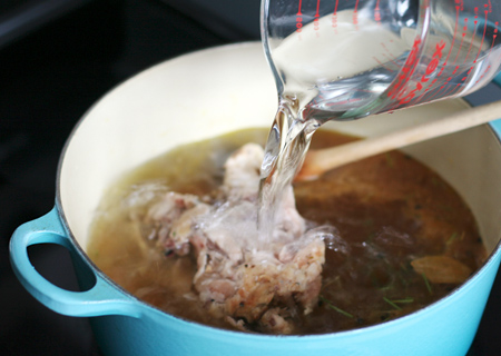 Add chicken carcass and water to stock pot