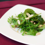 Mixed Green Salad with Pomegranate Dressing and Toasted Almonds