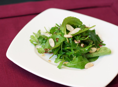 Mixed Green Salad with Pomegranate Dressing and Toasted Almonds