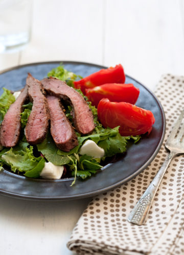 Pepper Crusted Steak Salad with Heirloom Tomato and Burrata