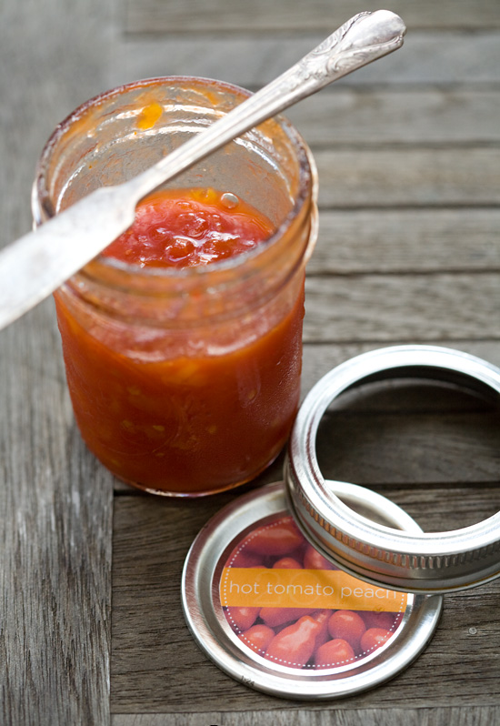 Spicy Tomato Peach Jam in jar with knife