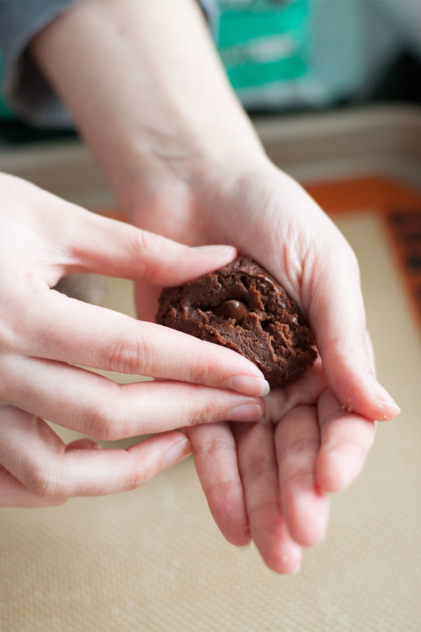 Stuffing soft chocolate sugar cookies recipe with mint kisses