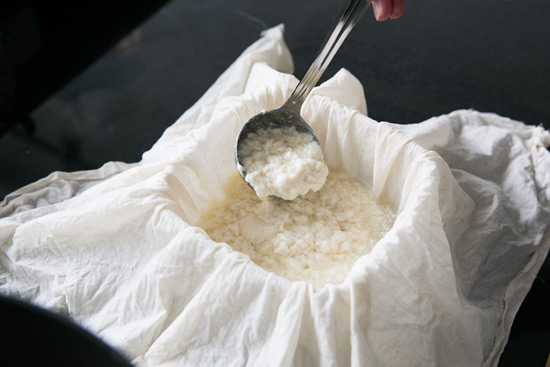 Ladling in the curds Making Homemade Tofu