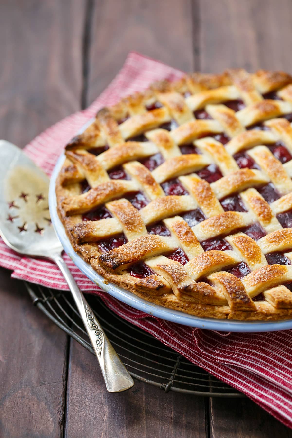 Tart Cherry Pie fresh out of the oven with a lattice pie crust top.