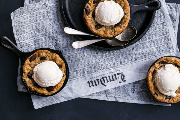 Mini Oatmeal Chocolate Chunk Skillet Cookies served a la mode with vanilla ice cream