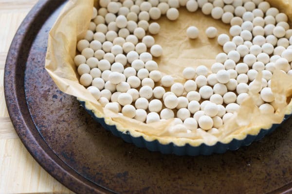 Baking the Cornmeal Crust for a Savory Squash Quiche