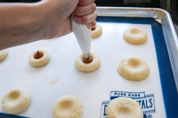 How to make shortbread thumbprint cookies filled with dulce de leche