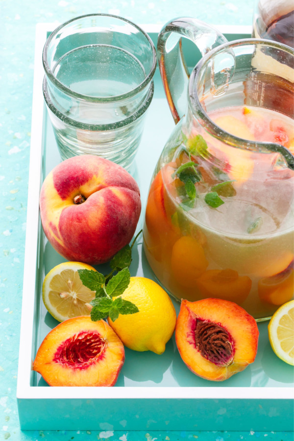 Bourbon Peach Lemonade Punch - A perfect make-ahead party cocktail recipe