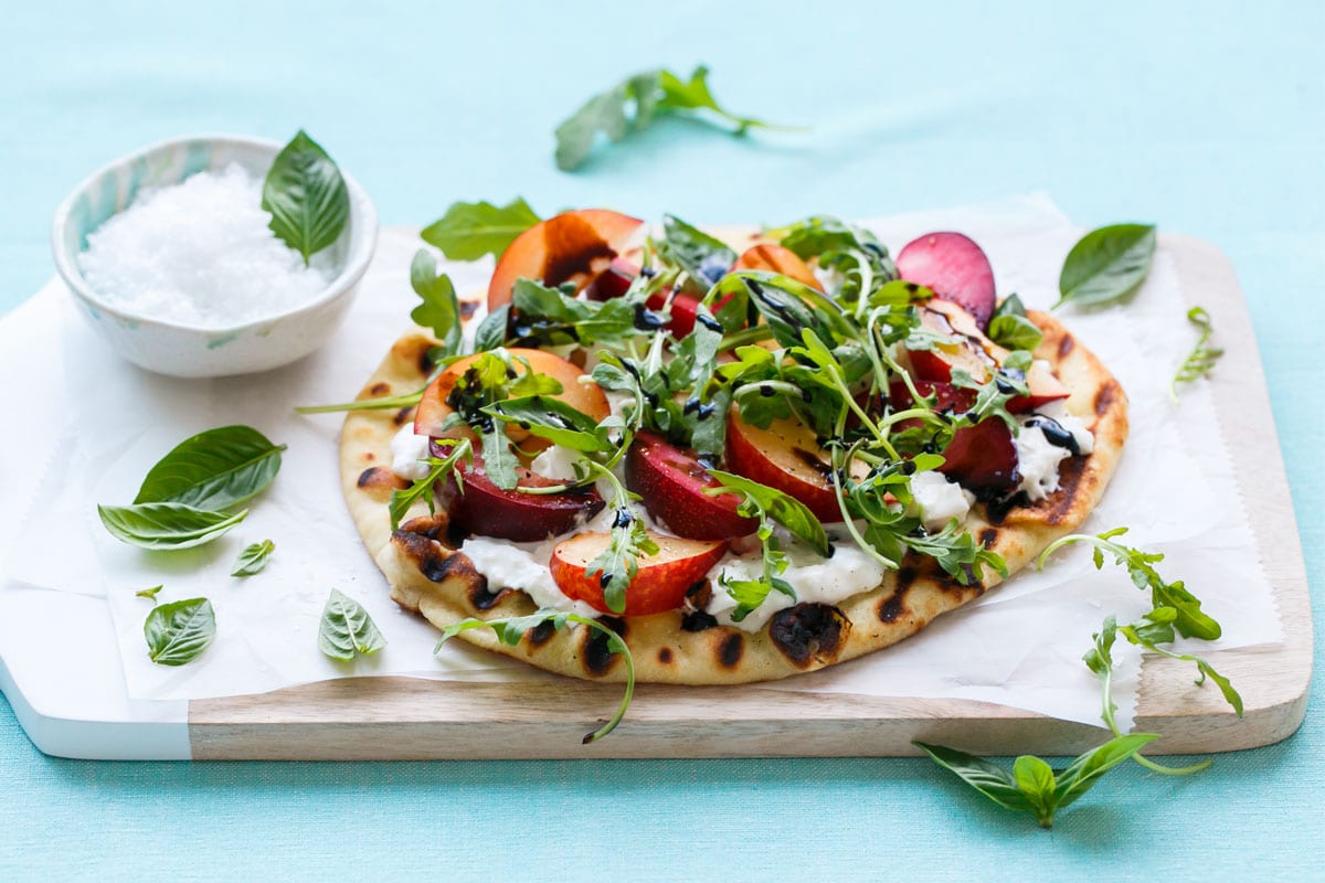 Plum and Burrata Flatbread with Basil, Arugula, and Balsamic Glaze