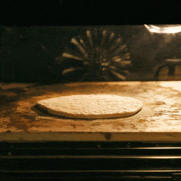 Homemade Pita Bread Puffing in the oven