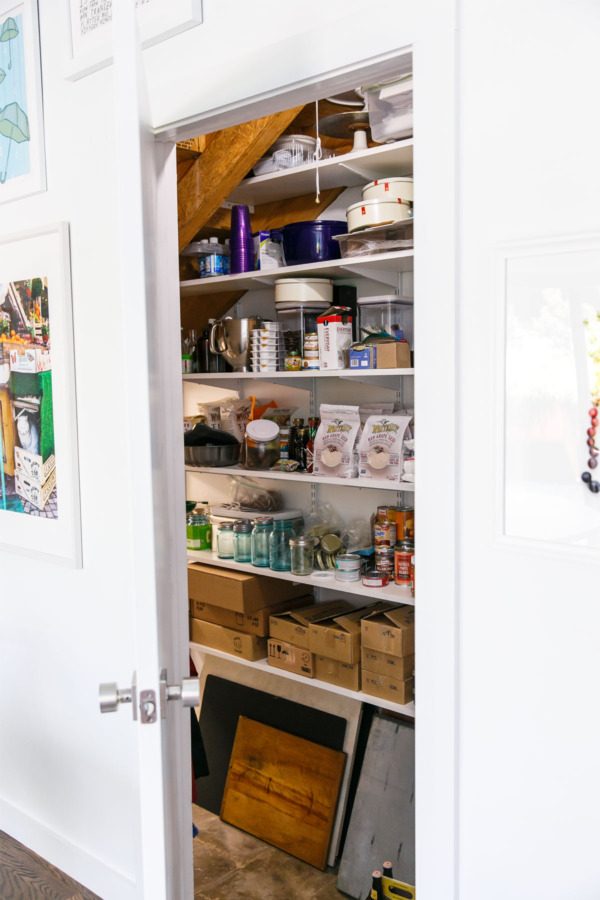 Townhouse Kitchen Remodel: Built-in pantry under the stairs.