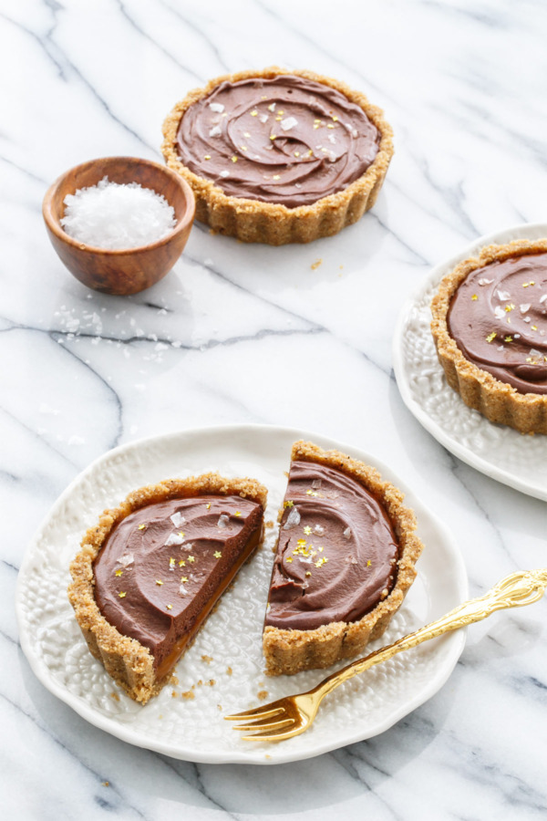 Looking for a unique and decadent dessert recipe? These Salted Dark Chocolate and Dulce de Leche Tarts are easy and impressive!
