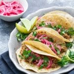 Slow-Cooker Pulled Pork Taco Recipe with Quick Pickled Onions on Top