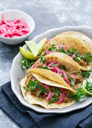 Slow-Cooker Pulled Pork Taco Recipe with Quick Pickled Onions on Top