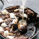 Dark and Fudgy Rocky Road Skillet Cookies with chocoalte chips, marshmallows, and almonds
