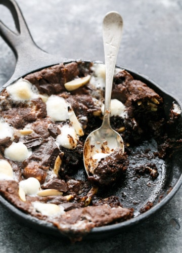 Dark and Fudgy Rocky Road Skillet Cookies with chocoalte chips, marshmallows, and almonds