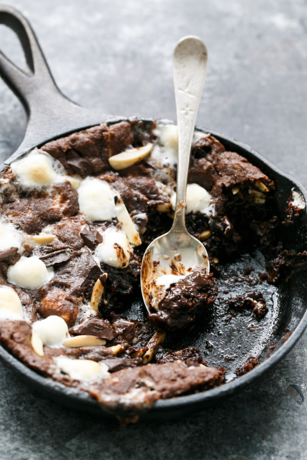 Dark and Fudgy Rocky Road Skillet Cookies with chocoalte chips, marshmallows, and almonds