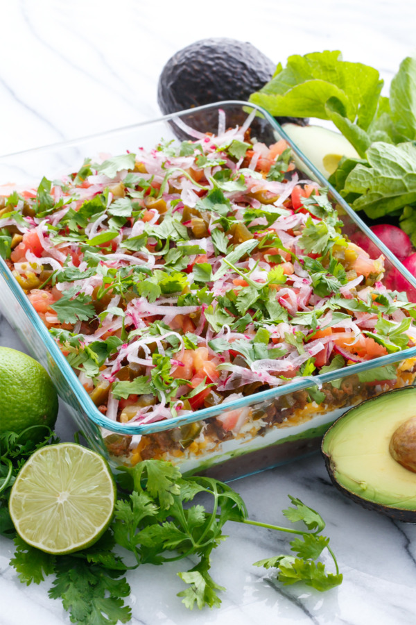 Mexican 7-Layer Dip with chorizo, pickled jalapenos and cilantro lime guacamole