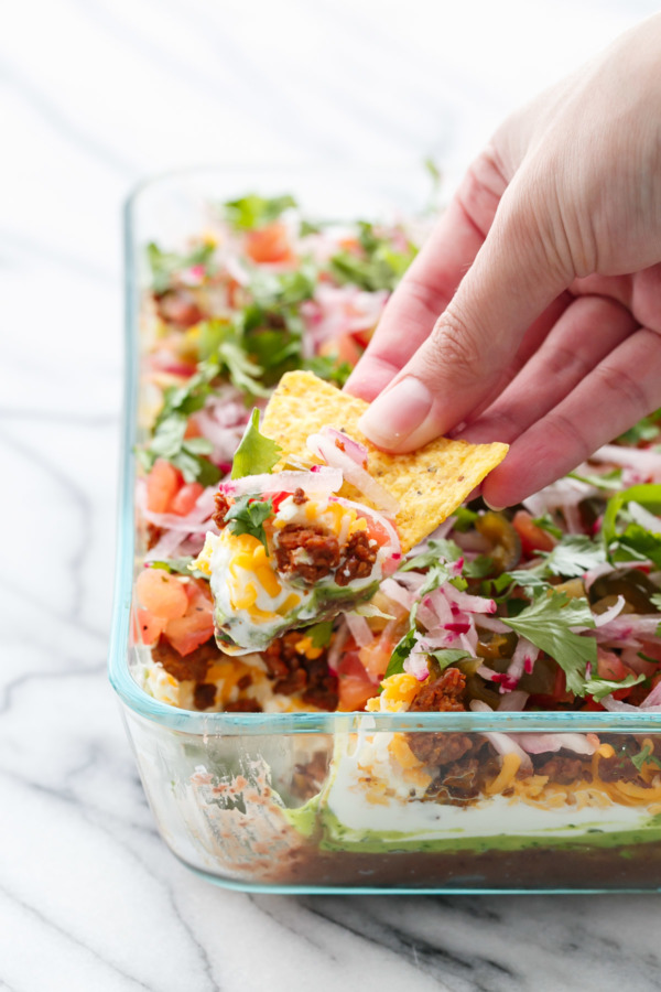 A fresh take on a classic party recipe: Mexican 7-Layer Dip with Chorizo and Cilantro-Lime Guacamole