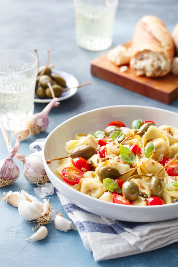 Looking for a quick & easy weeknight dinner recipe? Try this tortelloni with anchovies, capers, and cherry tomatoes!