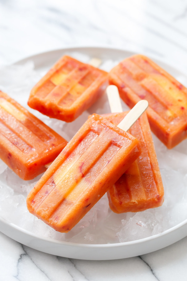 Grown up popsicles made with fresh peaches and rosé wine