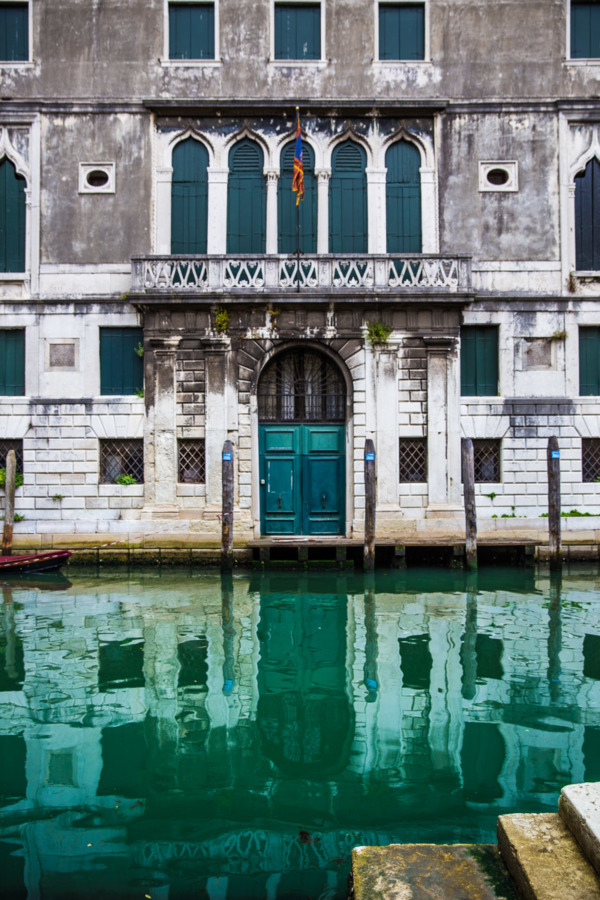 Weathered buildings and turquoise canals in Venice, Italy