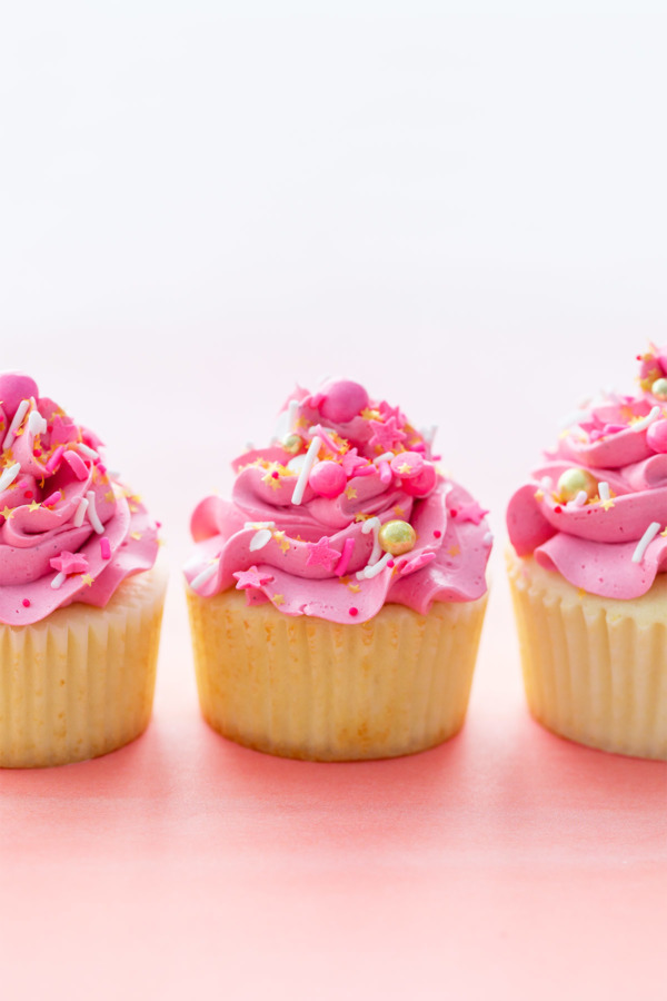 Light & Fluffy Vanilla Cupcakes with Creamy Marshmallow Buttercream (and filled with a sprinkle surprise!)