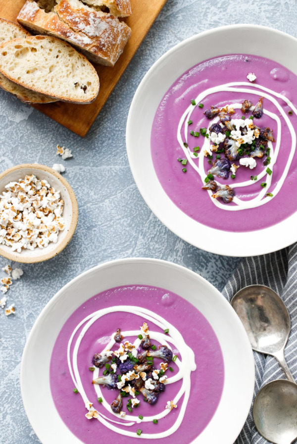 Purple Cauliflower & Sweet Potato Soup topped with popped sorghum, crispy cauliflower and crème fraîche