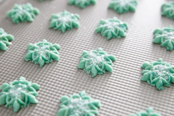 Snowflake Spritz Cookies with edible glitter