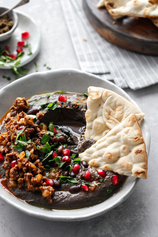 Black Sesame & Black Bean Hummus Recipe with spiced beef and pomegranate