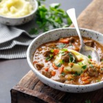 Loaded Beef Stew Recipe Served Over Mashed Potatoes