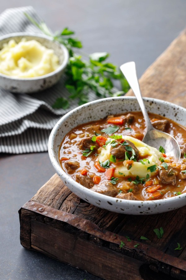 Loaded Beef Stew Recipe Served Over Mashed Potatoes