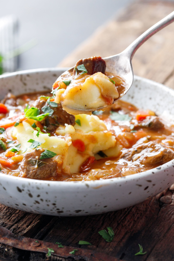 Hearty Beef Stew served over Creamy Mashed Potatoes (Like Shepherd's Pie, in stew form!)