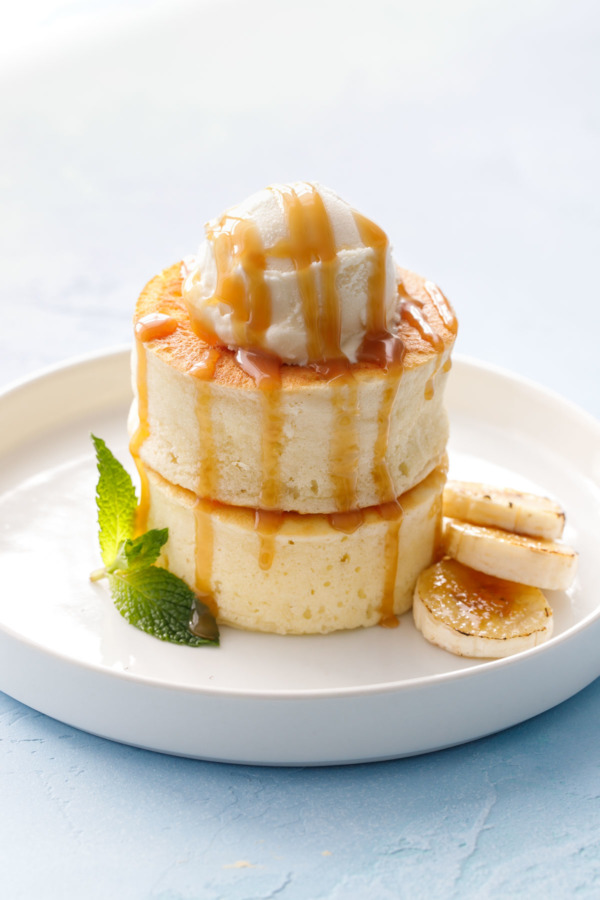 Dinner or dessert? Puffy Soufflé Pancakes with Bruleed Bananas, Ice Cream and Caramel Sauce.