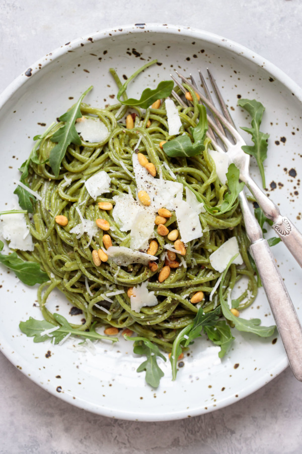 Arugula Cacio e Pepe with Pecorino cheese and toasted pine nuts