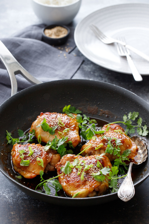 Honey Sriracha Chicken Thighs topped with cilantro and green onion