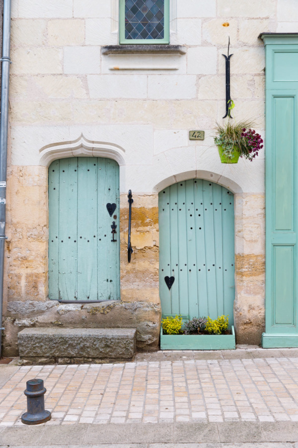 Charming mint green doors in Montreuil-Bellay, France