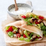 Yogurt-marinated Chicken served in a soft pita bread with yogurt Caesar dressing