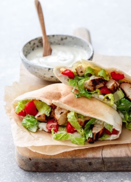 Yogurt-marinated Chicken served in a soft pita bread with yogurt Caesar dressing