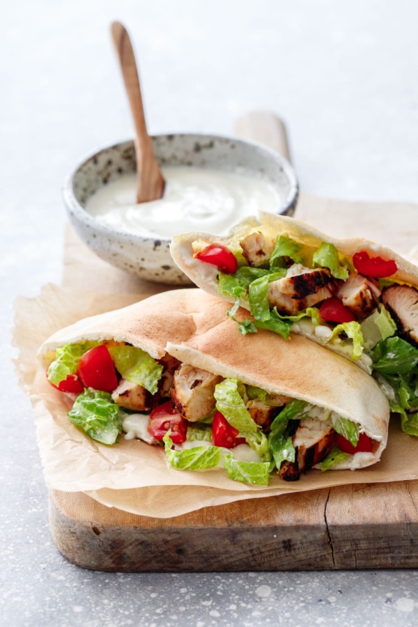 Yogurt-marinated Chicken served in a soft pita bread with yogurt Caesar dressing