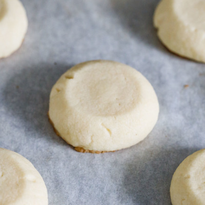 How to make the perfect shortbread thumbprint cookies - press them down again after baking to deepen the imprint.