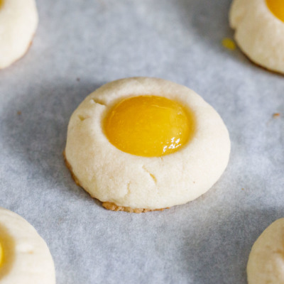 How to make the perfect shortbread thumbprint cookies - fill with your favorite filling (mango jam, in this case)