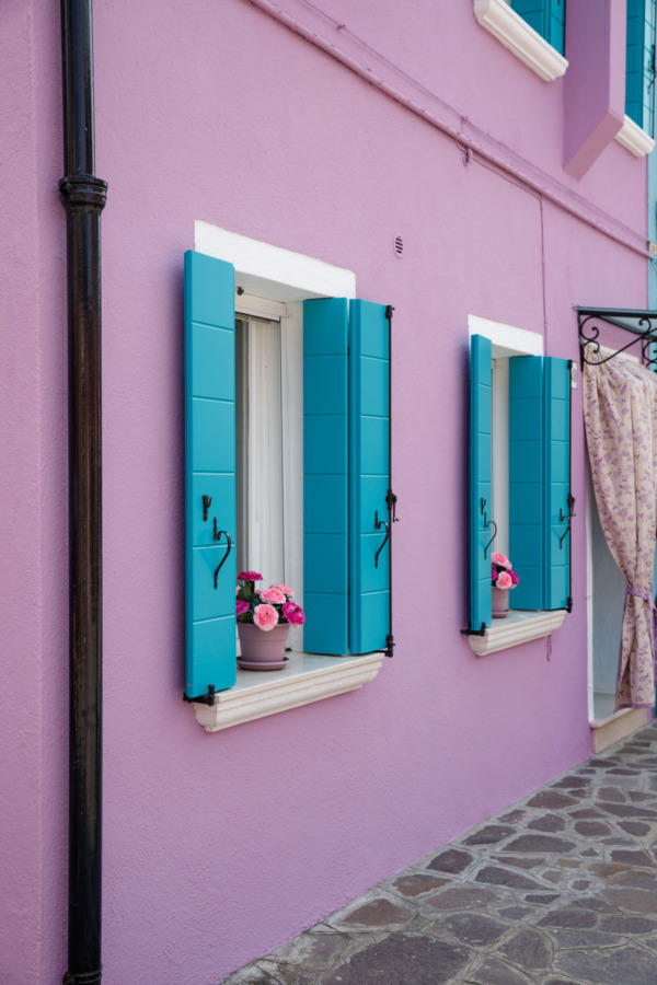 Purple house, blue shutters in Burano, Italy