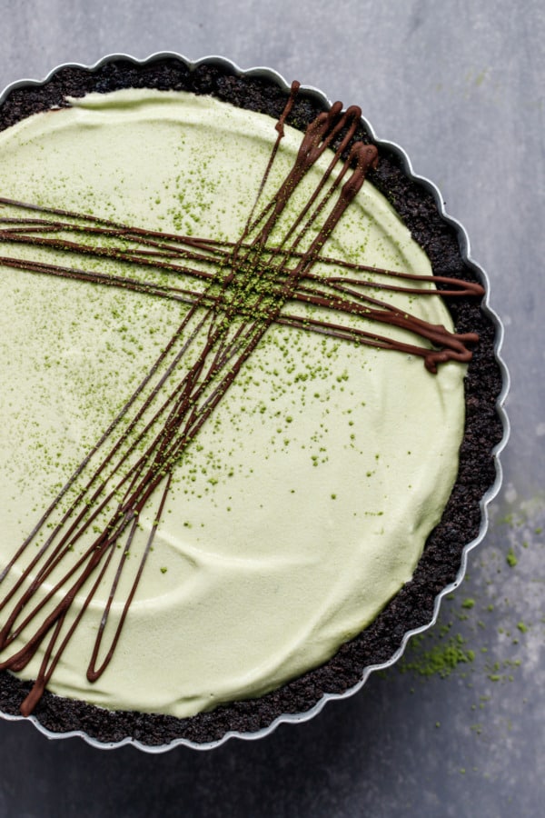 Matcha Mint Ice Cream Pie with Chocolate Cookie Crust and a layer of hot fudge sauce