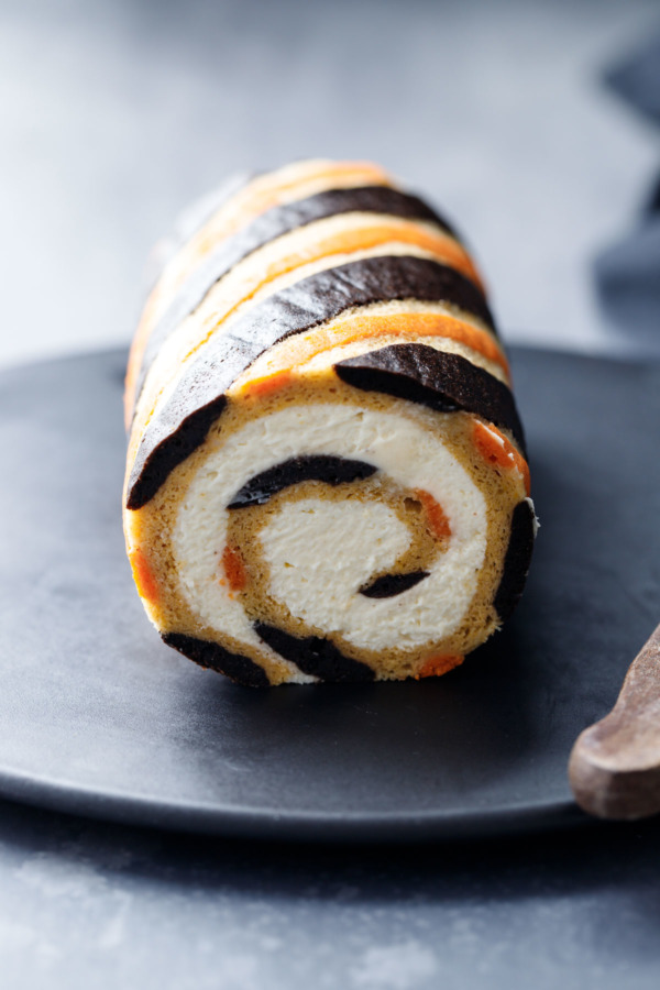 Halloween Cake Roll Recipe with orange and black striped design