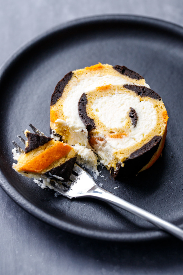 Slice of Pumpkin Cake Roll with Mascarpone Whipped Cream