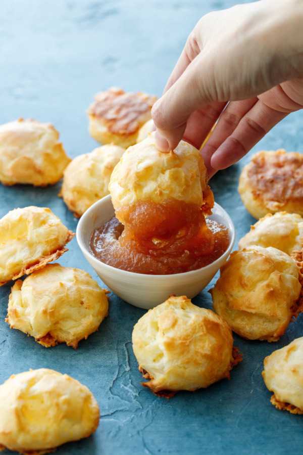 White Cheddar Gougère dipped in homemade apple Butter